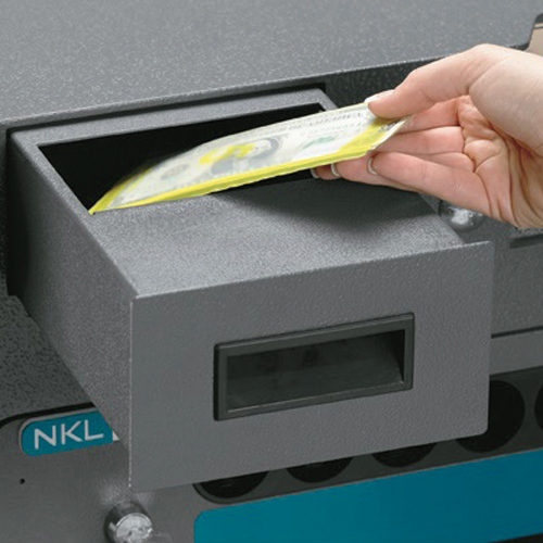 Person depositing money in safe