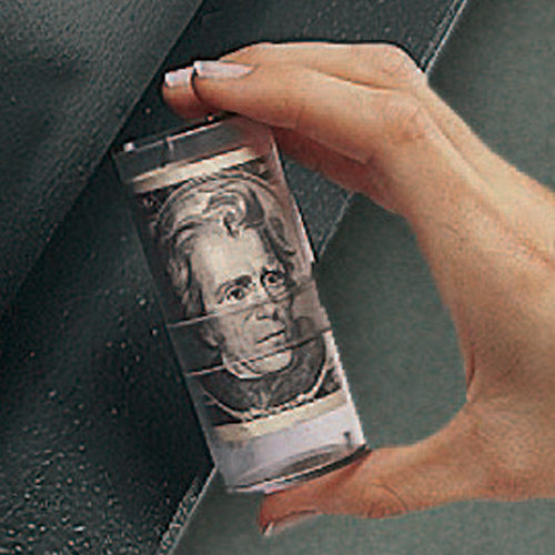 Tube of rolled up U.S. dollars